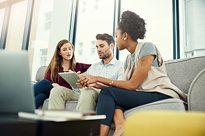 Buy stock photo Brainstorming, conversation and business people with tablet on sofa for communication, teamwork or discussion in office. Planning, ideas or employees with computer or technology for startup project