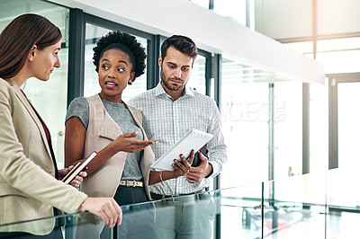 Buy stock photo Professional, business people and tablet for discussion in office for information, internet or news stories. Journalists, man or women with tech in workplace for opinion or content update or teamwork