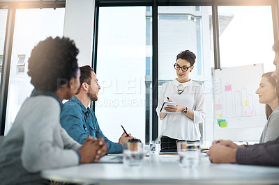 Buy stock photo Team, woman and writing in brainstorming, office or boardroom for project as management for company or business. Group, presentation and whiteboard with sticky notes and graph for metrics in meeting