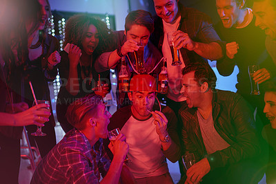 Buy stock photo Cropped shot of a group of friends drinking and having fun at a party