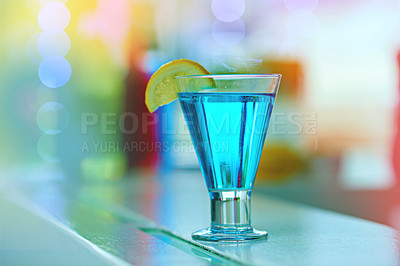 Buy stock photo Cocktail, alcohol and beverage isolated in nightclub or bar for party, fun and happy hour. Blue lagoon, bar counter and no people in Caribbean for event, celebration and tiki drink special in tavern
