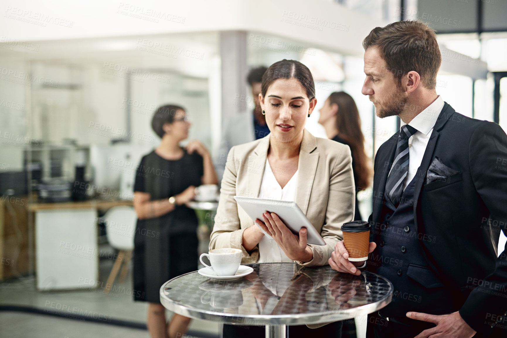 Buy stock photo Business people, tablet and coffee with discussion for research, proposal or collaboration at office. Businessman and woman with technology, drink or ideas for conversation on project at workplace