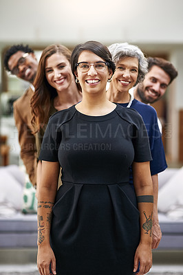 Buy stock photo Portrait of a group of businesspeople standing in a line in an office