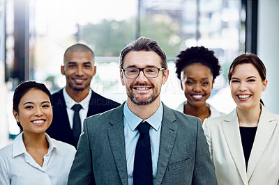 Buy stock photo Portrait of a group of businesspeople standing together in their office