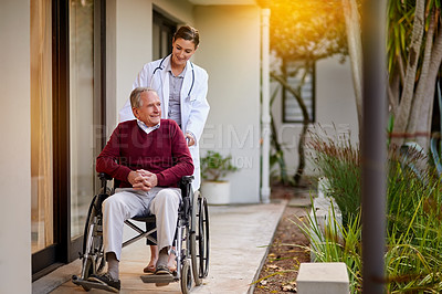 Buy stock photo Shot of an elderly man in a wheelchair being assisted by a nurse outside a clinic