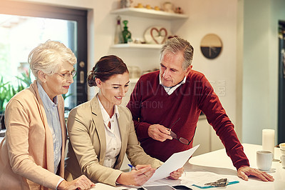 Buy stock photo Senior couple, accountant and documents in finance, budget or agreement for consultation at home. Happy elderly man and woman with consultant or lawyer for financial planning, paperwork or investment
