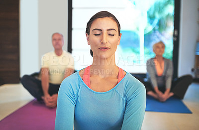 Buy stock photo Cropped shot of a yoga instructor guiding a senior couple in a yoga class