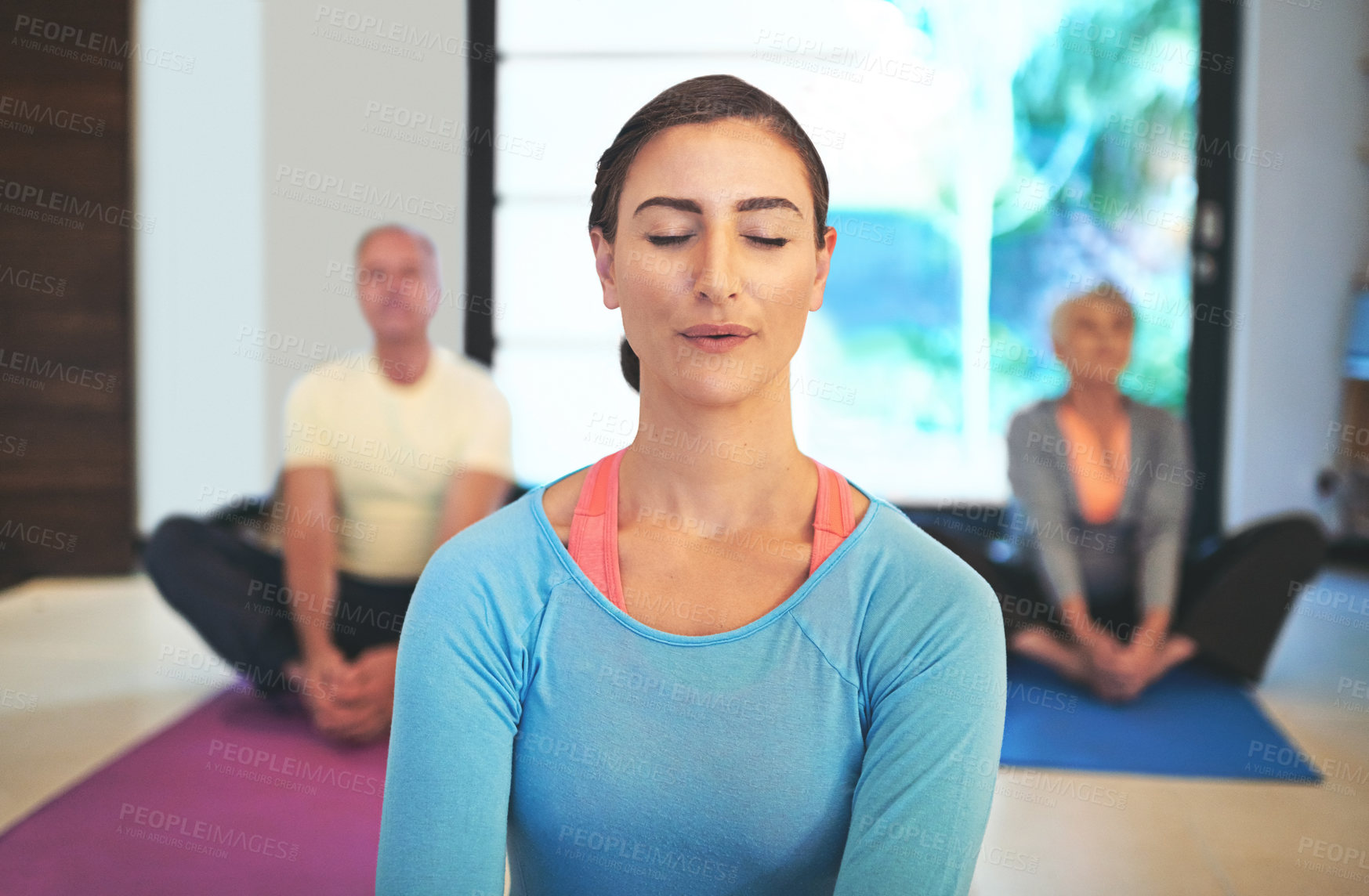 Buy stock photo Cropped shot of a yoga instructor guiding a senior couple in a yoga class