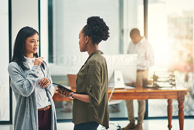 Buy stock photo Cropped shot of young creatives having a discussion in an office