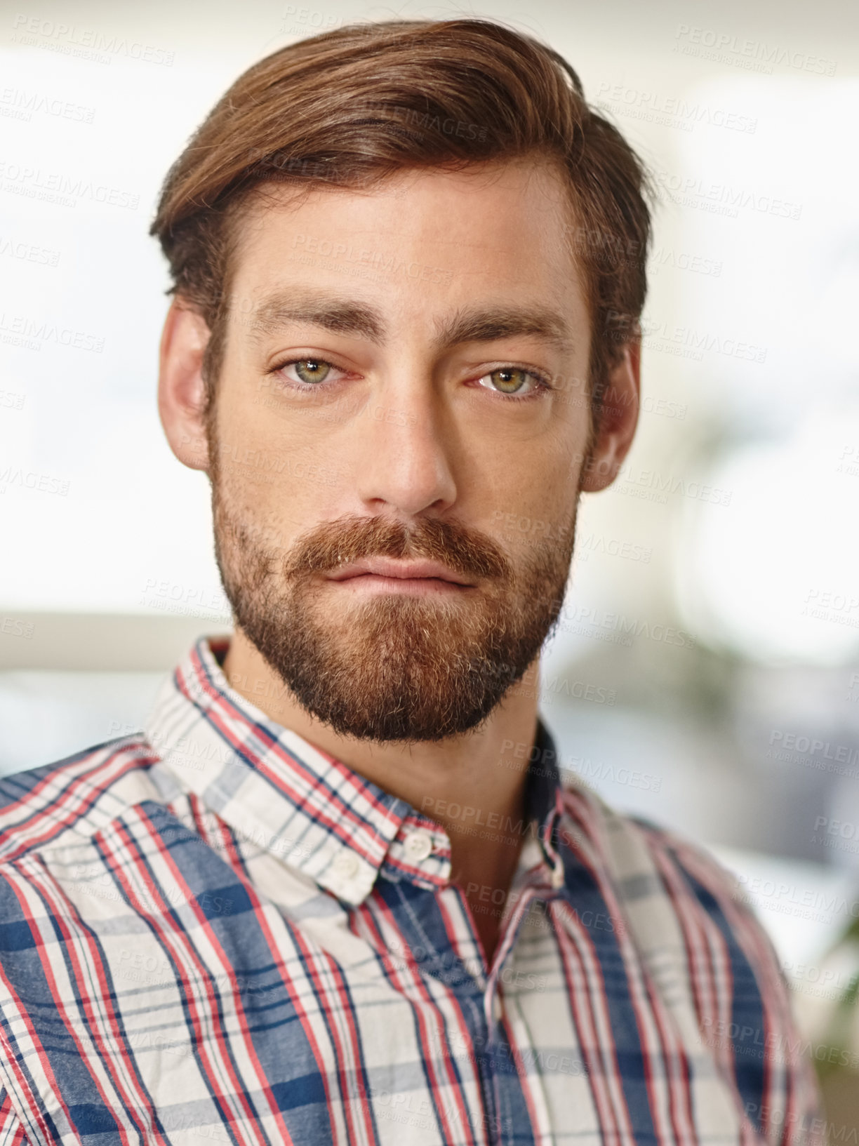 Buy stock photo Portrait of a young businessman standing in an office