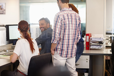 Buy stock photo Cropped shot of a group of colleagues working together in an office