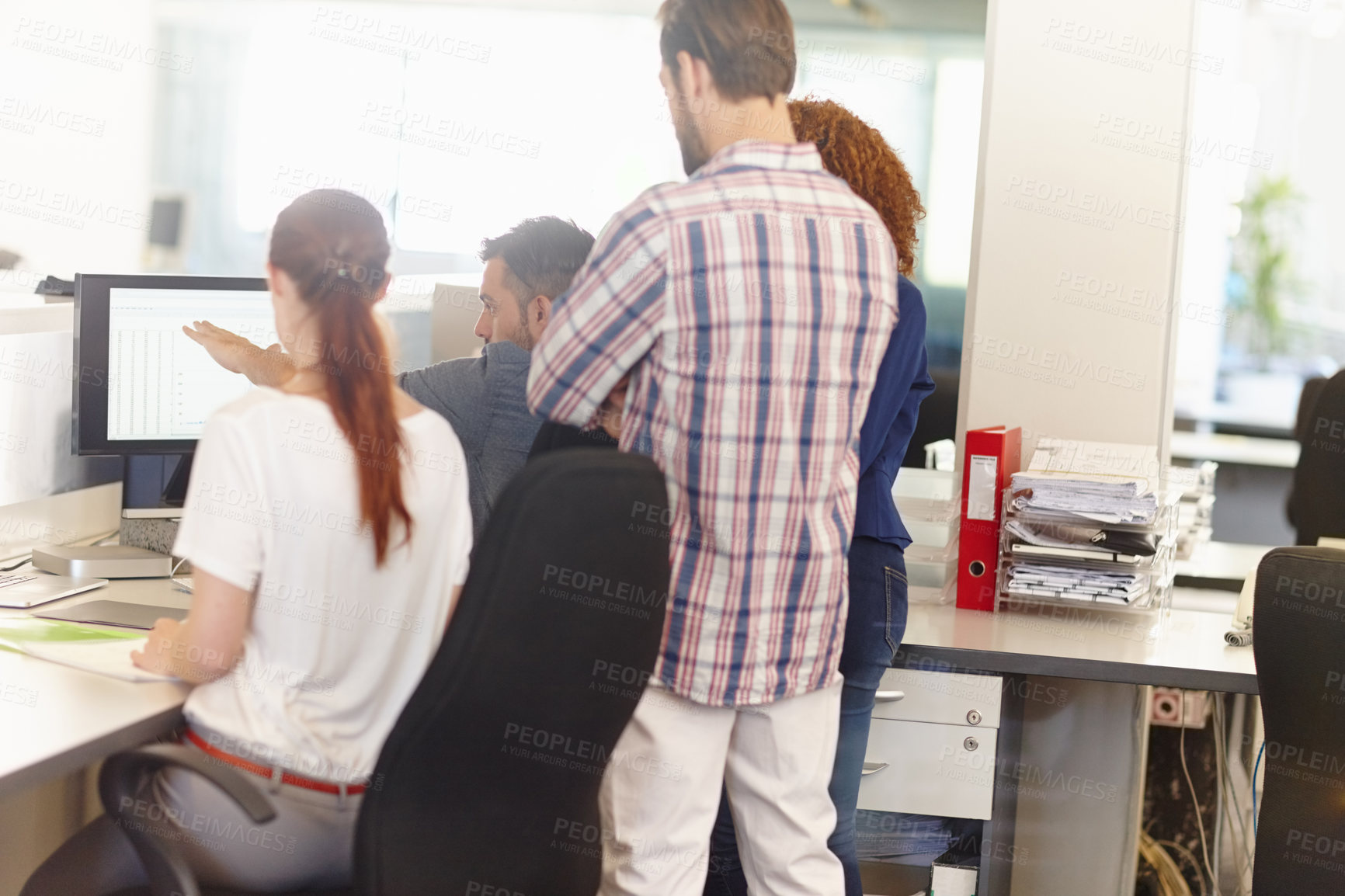 Buy stock photo Cropped shot of a group of colleagues working together in an office