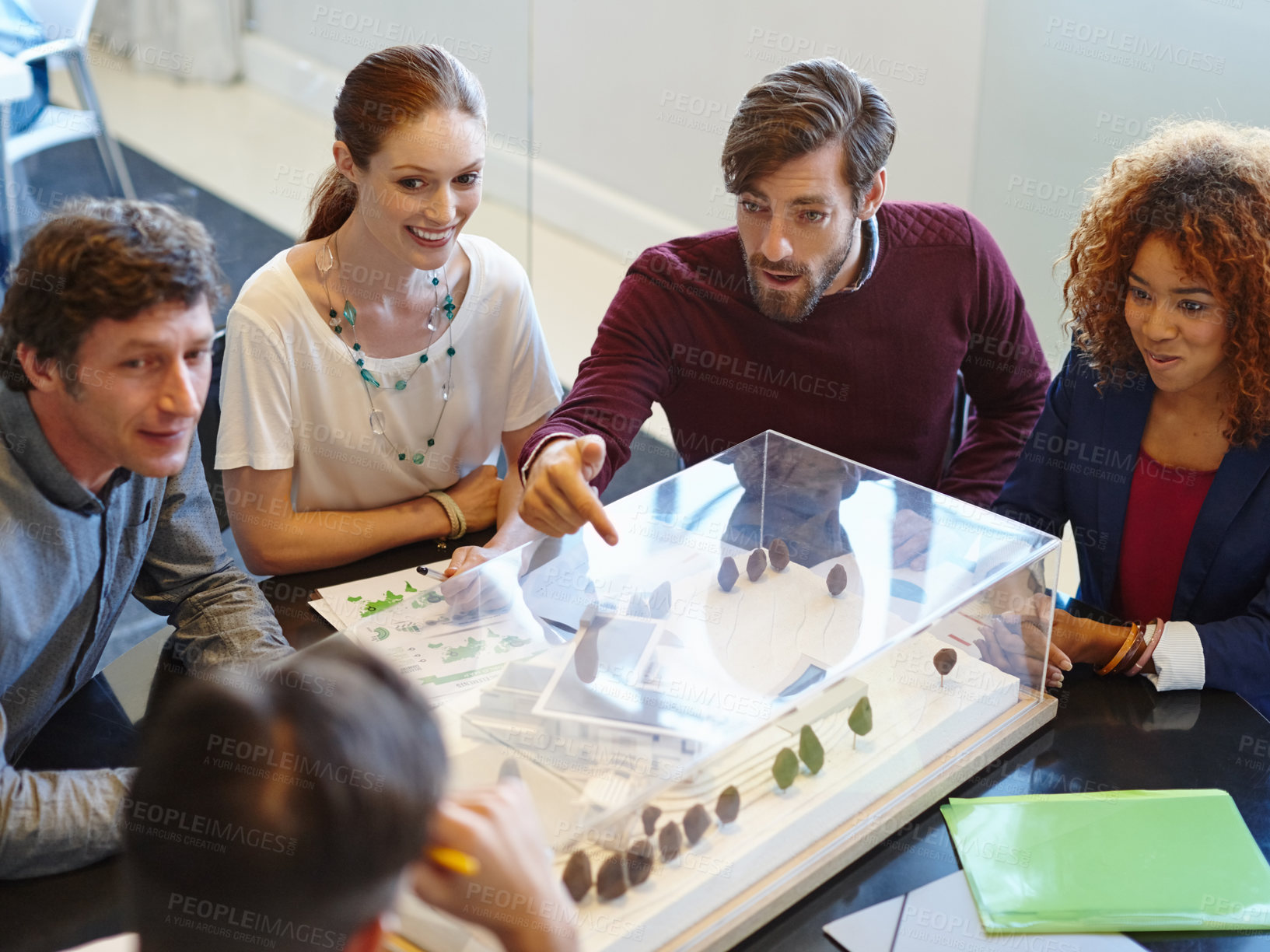 Buy stock photo Shot of a group of architects having a meeting in their boardroom