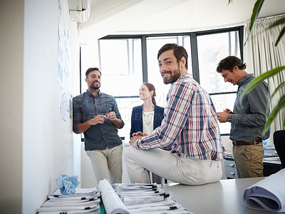 Buy stock photo Portrait of a group of colleagues having a brainstorming session at work