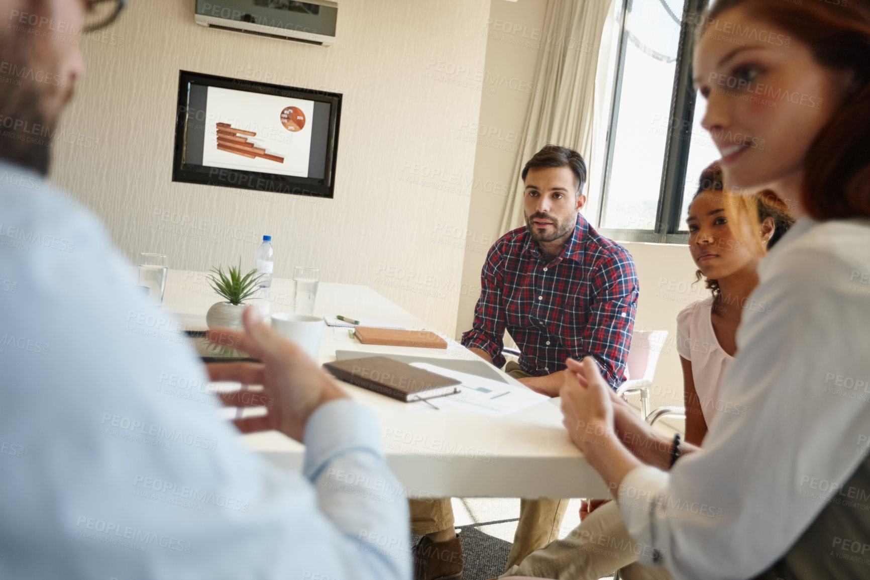 Buy stock photo Shot of a group of colleagues having a meeting at work