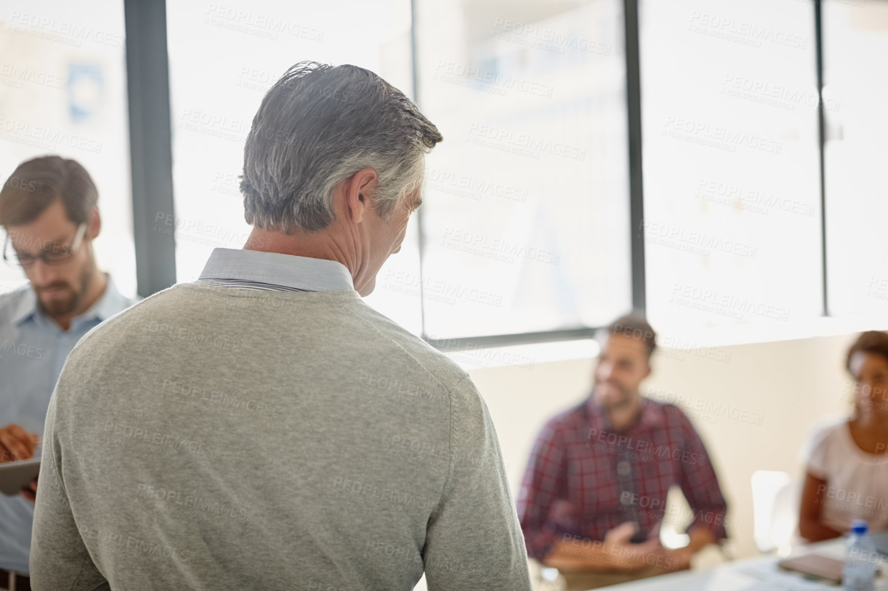 Buy stock photo Shot of a group of colleagues having a meeting at work