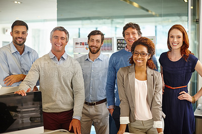 Buy stock photo Portrait of a diverse team of professionals working in an office