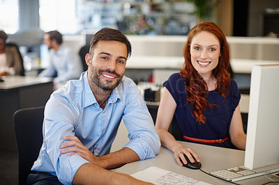 Buy stock photo Portrait of two coworkers using a computer together at work