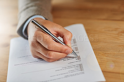 Buy stock photo Closeup shot of a man filling out a medical questionnaire