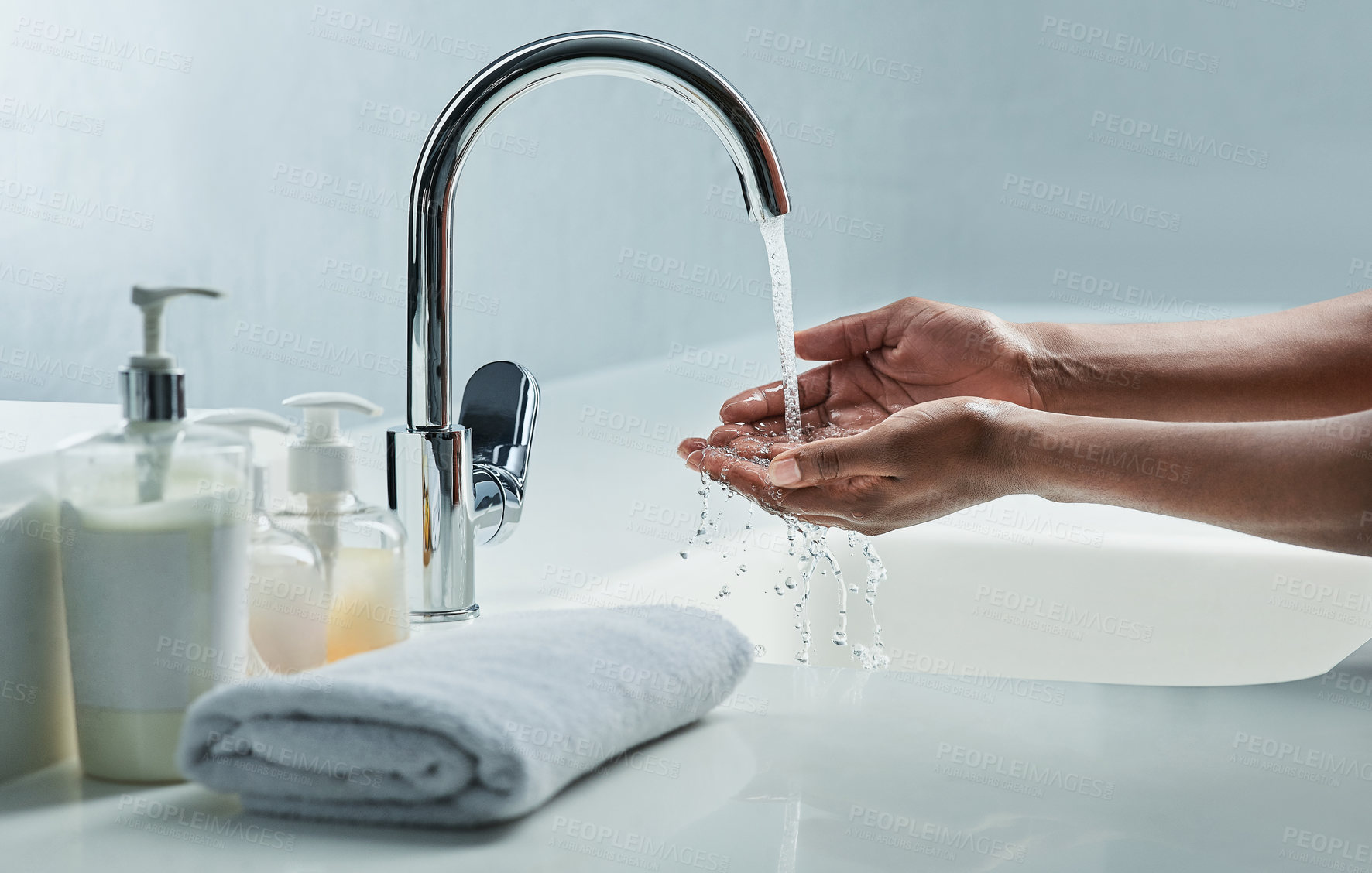 Buy stock photo Cropped shot of a man washing his hands in a bathroom sink