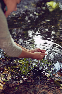 Buy stock photo Pond, nature and woman washing hands, ecology and environment with sustainability, hygiene and sunshine. Person, outdoor and girl in forest, water splash and prevent germs with hydration and river