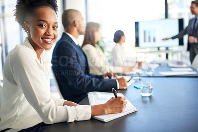 Buy stock photo Portrait of a young businesswoman sitting in a boardroom meeting with colleagues