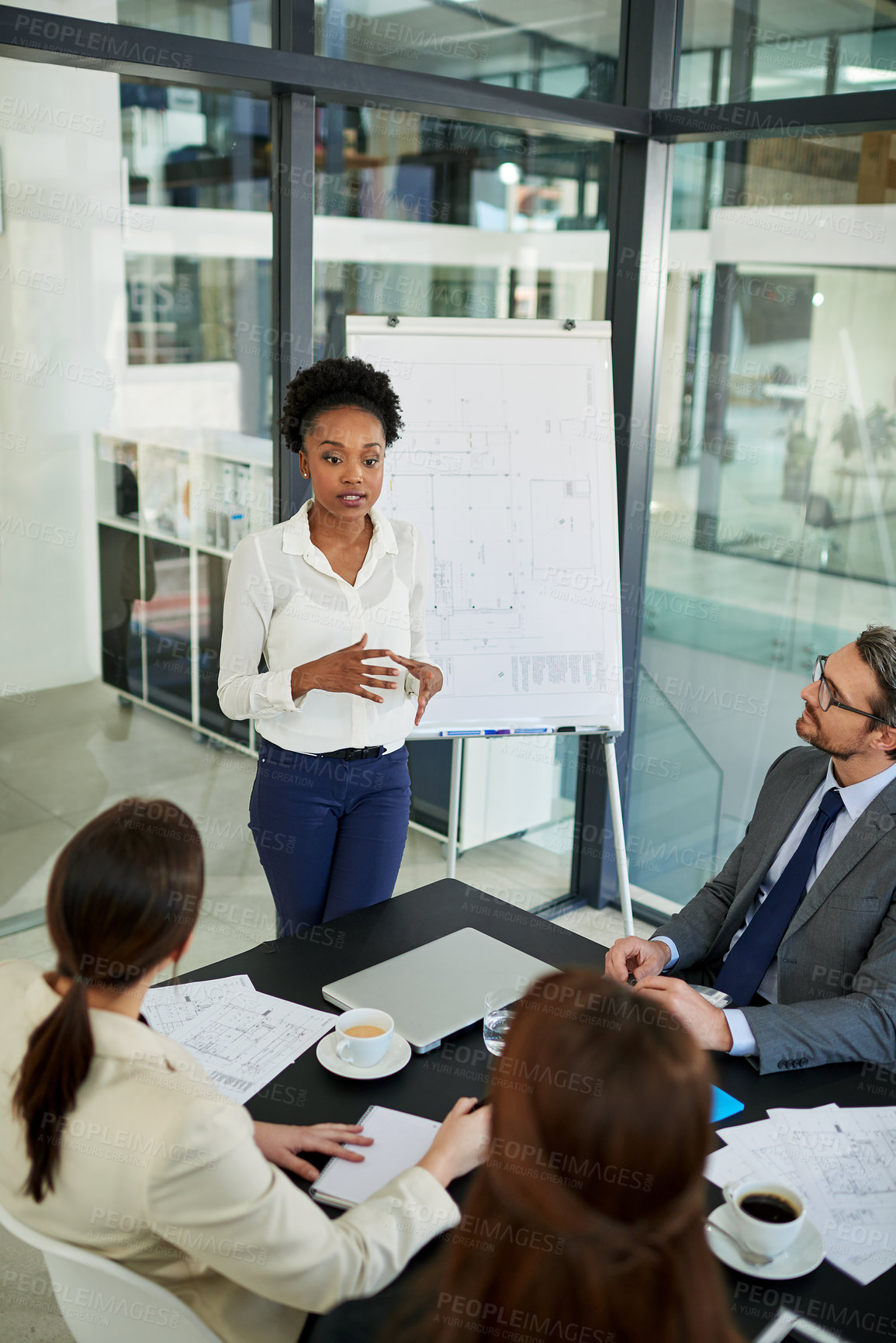 Buy stock photo Cropped shot of a group of business colleagues meeting in the boardroom