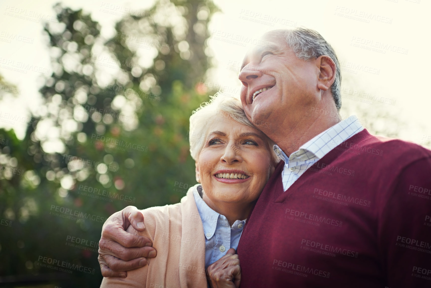 Buy stock photo Shot of an affectionate senior couple enjoying some time outside