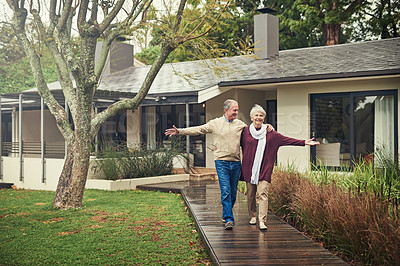 Buy stock photo Happy senior couple, garden and walk with smile, hug and together with love, bonding and freedom in winter. Old woman, happy man and embrace in backyard in retirement, nature and outdoor in morning