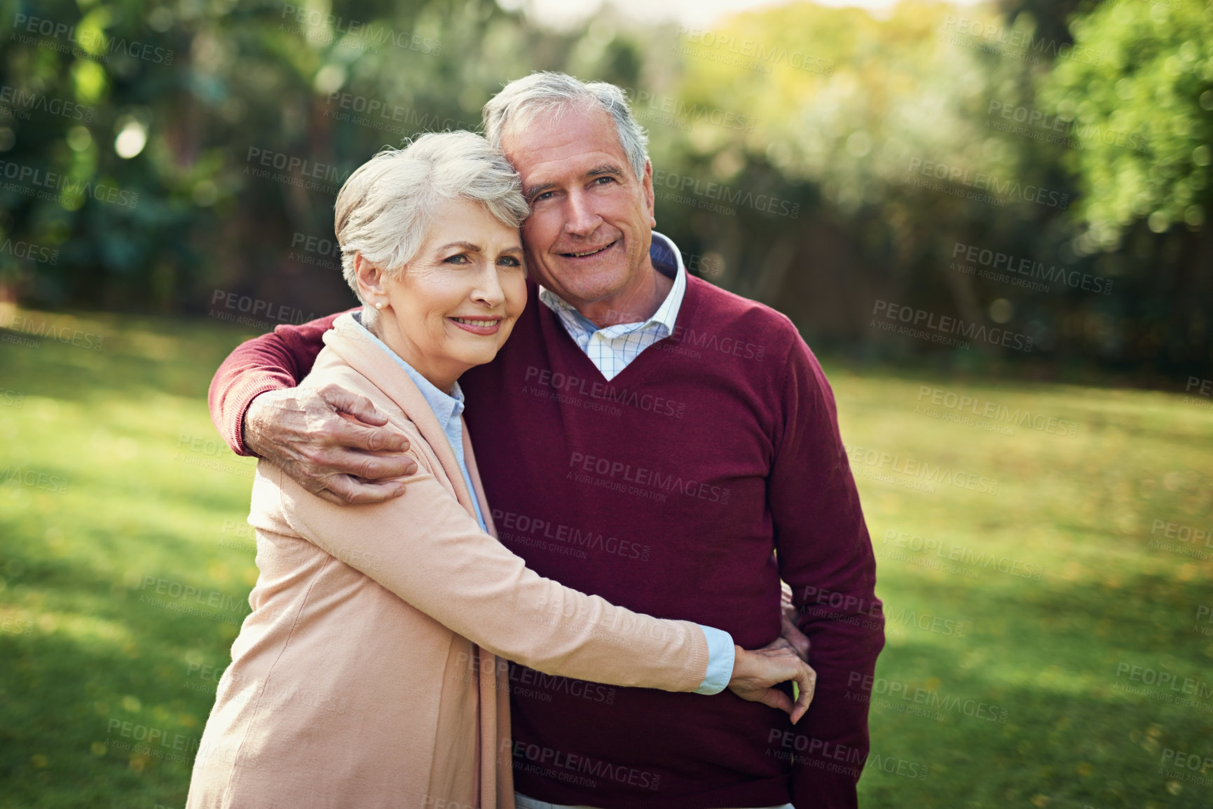 Buy stock photo Portrait of an affectionate senior couple enjoying some time outside