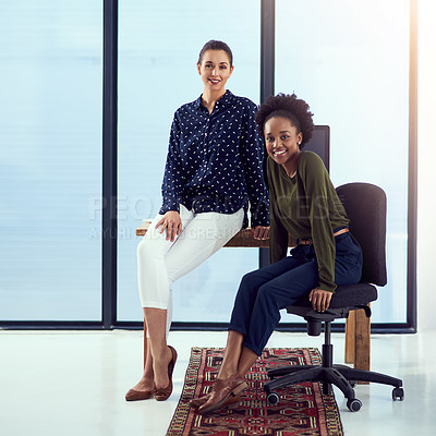 Buy stock photo Portrait of two young designers at a work station in front of a window