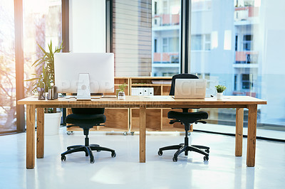 Buy stock photo Shot of an empty office space workspace
