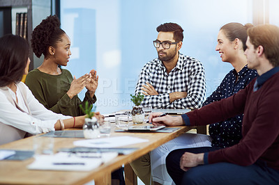 Buy stock photo Shot of a group of businesspeople having a meeting in the boardroom