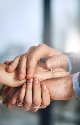 Buy stock photo Cropped shot of two colleagues holding hands