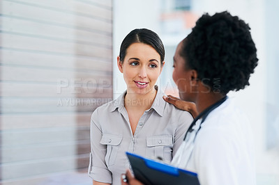 Buy stock photo Cropped shot of a female doctor talking to a patient in the hospital