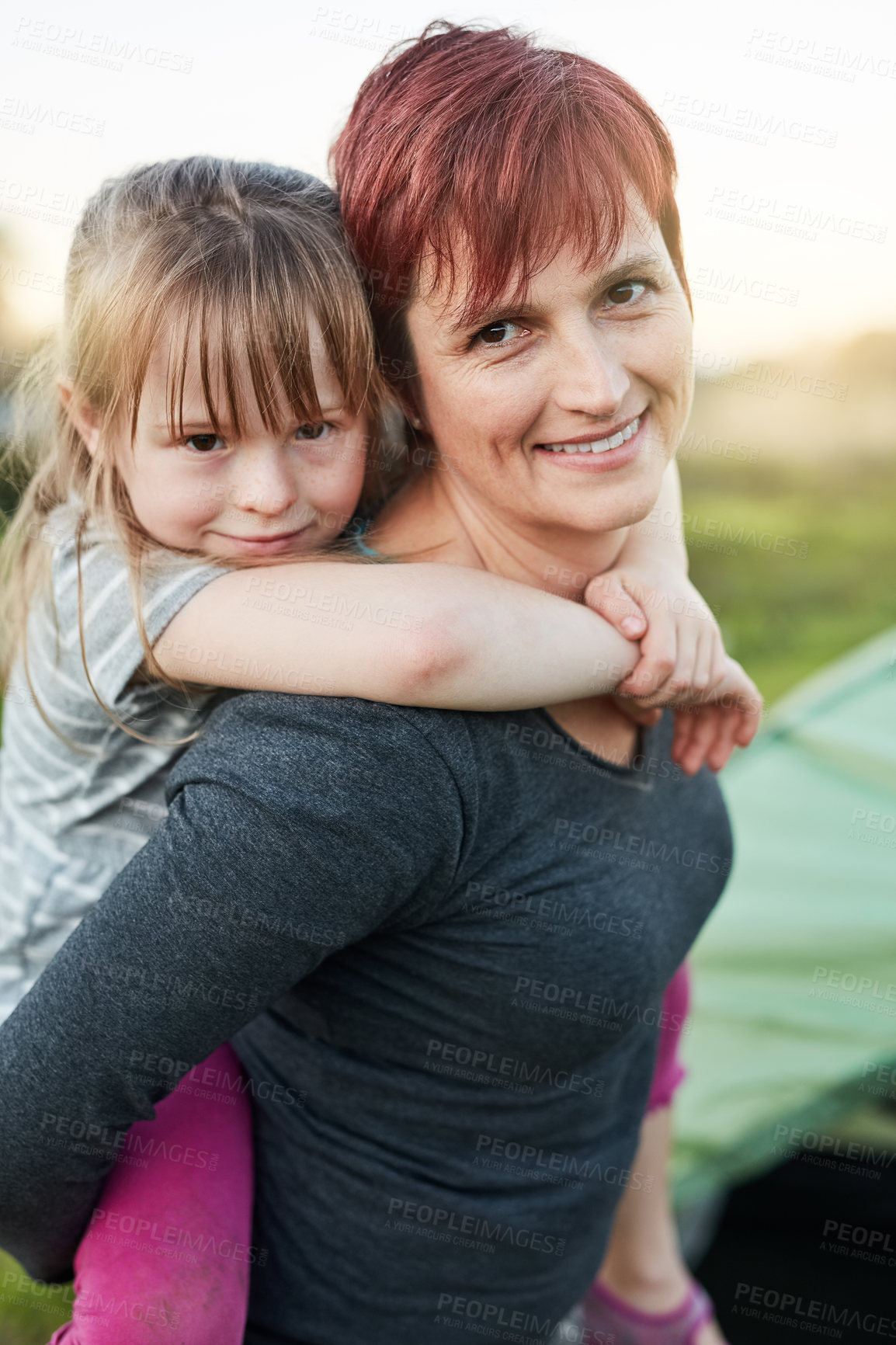 Buy stock photo Cropped portrait of a little girl and her mother standing outside