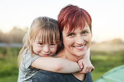Buy stock photo Cropped portrait of a little girl and her mother standing outside