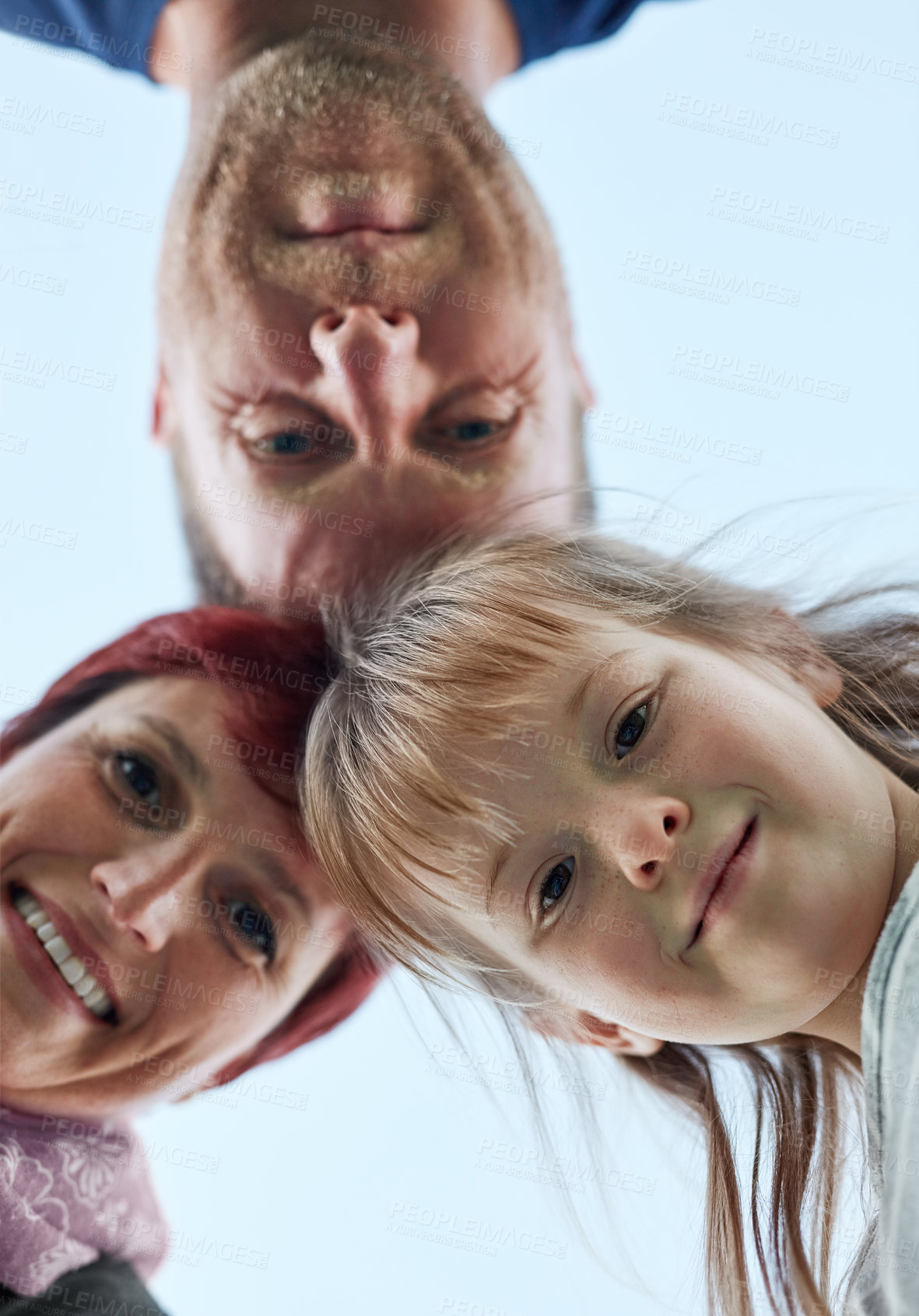 Buy stock photo Huddle, love and portrait of family on blue sky from below together for bonding or trust in summer. Happy, smile or support with face of daughter, father and mother outdoor in nature for unity