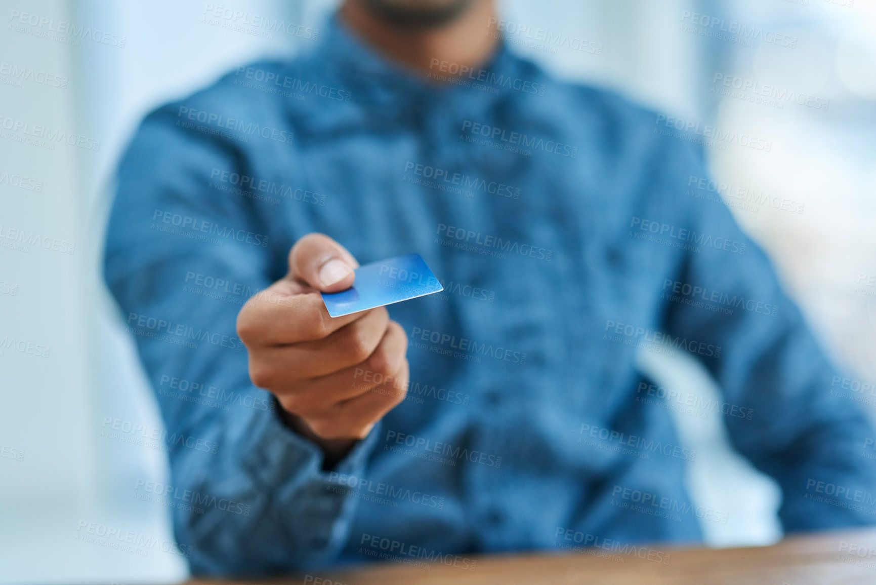 Buy stock photo Shot of an unidentifiable businessman holding out his credit card