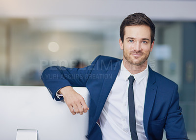 Buy stock photo Portrait of a young businessman leaning on his pc in the office