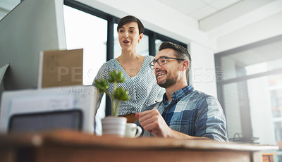 Buy stock photo Cropped of colleagues working together on a computer in a modern office