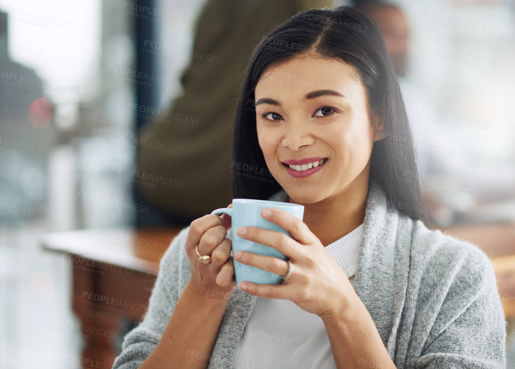 Buy stock photo Portrait of a young businesswoman enjoying a cup of coffee