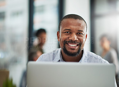 Buy stock photo Portrait of a mature businessman working on a computer in an office