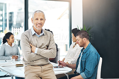 Buy stock photo Portrait, meeting and businessman with arms crossed in office for teamwork, workflow support or collaboration. Startup, lens flare and mature person by staff for leadership, management or confidence