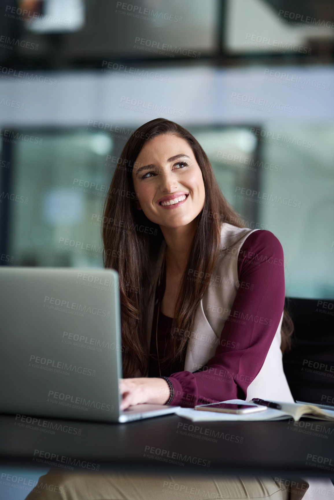 Buy stock photo Shot of a businesswoman sitting at her desk with her laptop