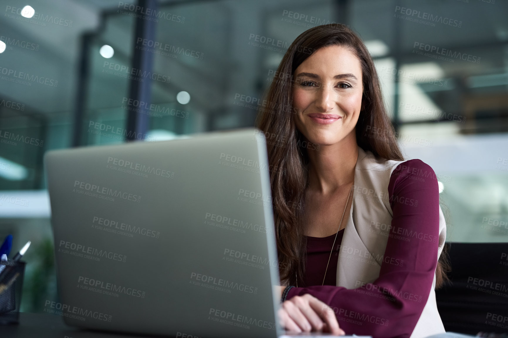 Buy stock photo Woman, office and smile with laptop in portrait for company with pride, confident and satisfied with career growth. Female person, employee and happy in desk with computer at work as hr manager