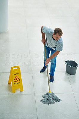 Buy stock photo Man, janitor and mopping office for cleaning job or hygiene with caution sign with water, soap or bacteria. Male person, disinfection and corporate building as service for dirty, wellness or labor