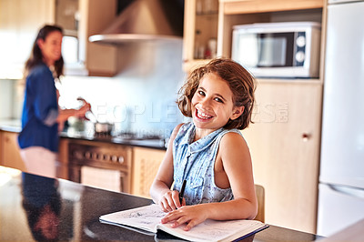 Buy stock photo Child, homework and portrait of girl in home for education, learning or working on school assessment in kitchen. Smile, student and young kid with notebook for knowledge, development or writing