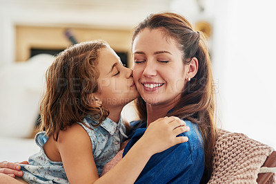 Buy stock photo Cropped shot of a young girl kissing her mother at home