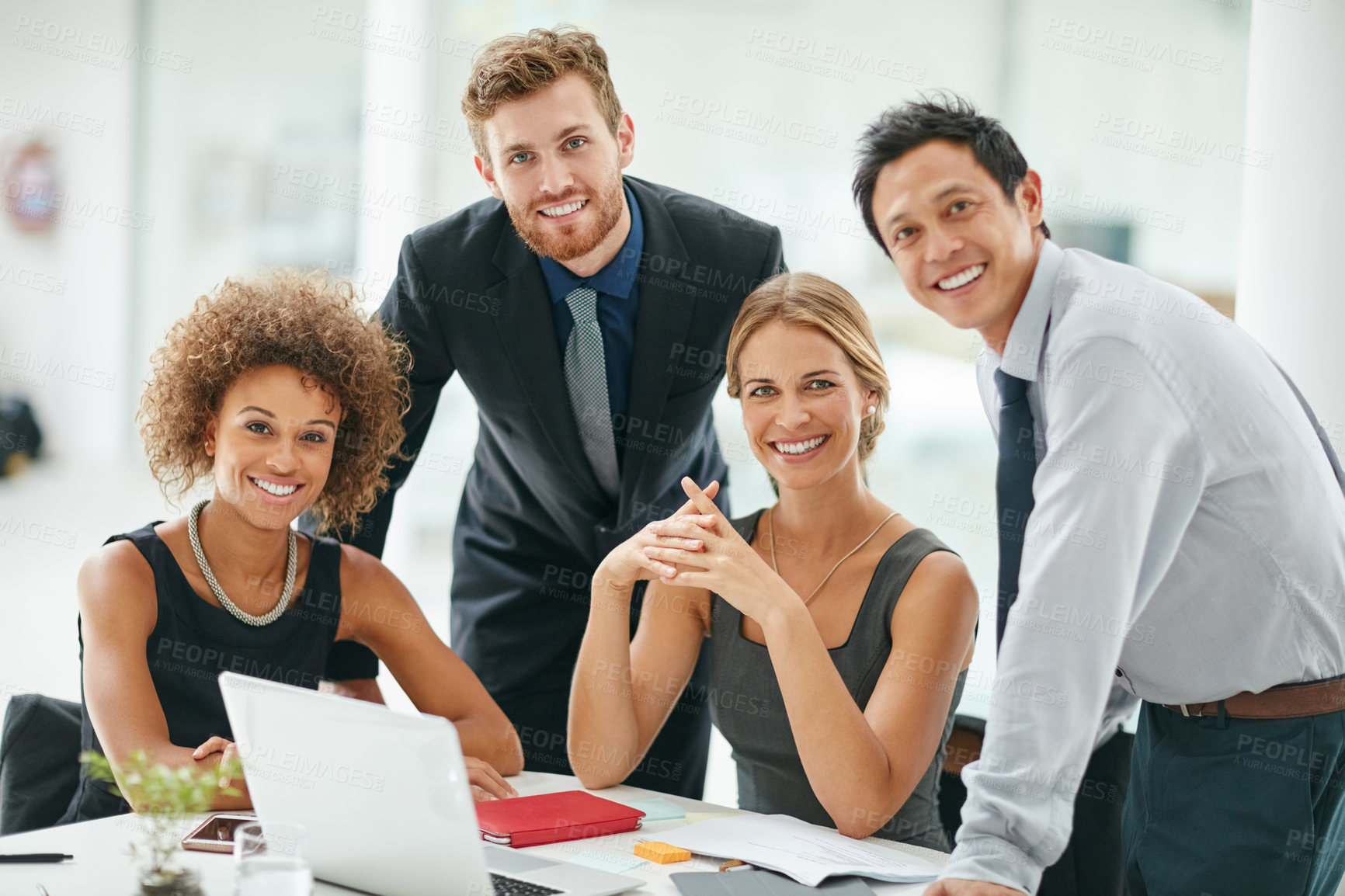 Buy stock photo Portrait of a group of businesspeople working on a  laptop together in a modern office